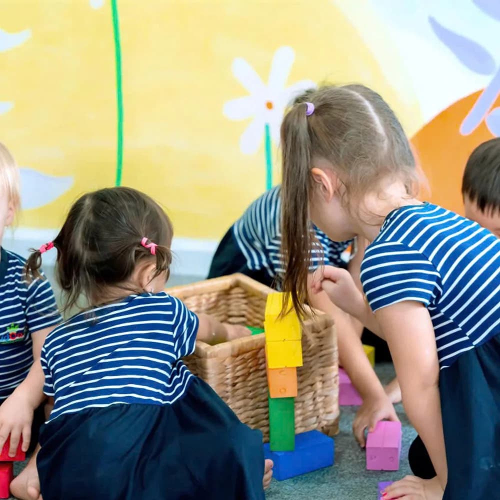 Kid Castle students playing with colorful building blocks during the Saturday Program