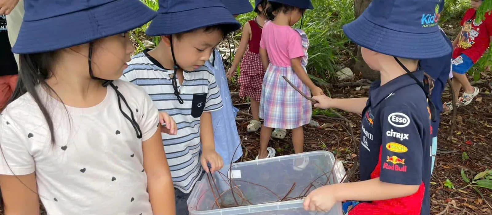 Kid Castle students exploring nature together during a community outing