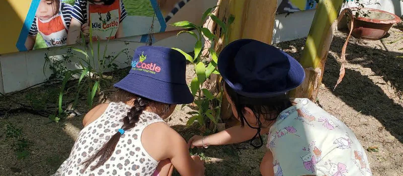 Kid Castle students exploring the garden on campus